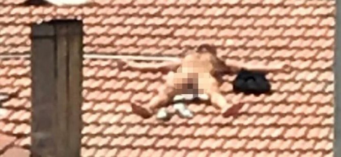 Burdur'da çatıda çıplak yatan kişi gözaltına alındı