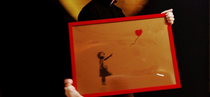 Elindeki Banksy eserini değerlenir ümidiyle kesti, değeri neredeyse sıfıra indi